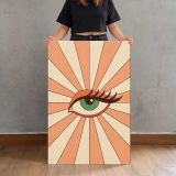 Green Eye with Peach Sunburst canvas print, held for scale