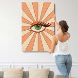 Green Eye with Peach Sunburst canvas print, displayed on a wall
