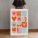 Orange Pink and Turquoise Heart Collage canvas print, held for scale