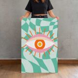 Pink Eye on Green Checkerboard canvas print, held for scale