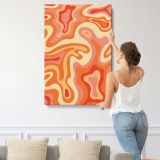 Orange and Cream Psychedelic Swirls canvas print, displayed on a wall