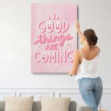 Good Things Are Coming Pink Typography canvas print, displayed on a wall