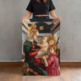 Madonna and Child with Angels by Sandro Botticelli canvas print, held for scale
