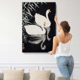 White Chinese Geese Swimming by Reeds by Ohara Koson canvas print, displayed on a wall