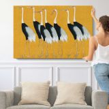 Japanese Cranes on Gold - single-panel canvas shown with a person for scale