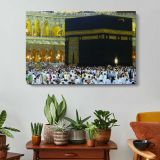 Kaaba Close View with Pilgrims - single-panel canvas displayed above a console table