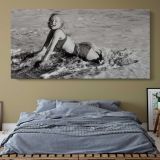 Marilyn Monroe on the Beach - 1952 — single-panel canvas above a bed with blue bedding
