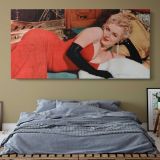 Marilyn Monroe Reclining in Red - 1955 — single-panel canvas above a bed with blue bedding