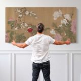 One Hundred Flowers after Yun Shouping — single-panel canvas shown behind a standing person for scale