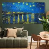Starry Night Over the Rhone by Vincent van Gogh — single-panel canvas above a green sofa
