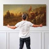 The Ambush by Adolf Schreyer — single-panel canvas shown behind a standing person for scale