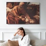 The Sacrifice of Isaac by Caravaggio - single-panel canvas displayed above a sofa