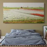 Tulip Fields by Gerrit Willem Dijsselhof — single-panel canvas above a bed with blue bedding