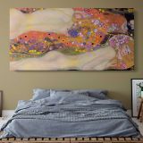 Water Serpents II by Gustav Klimt — single-panel canvas above a bed with blue bedding