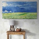 Wheatfield under Thunderclouds by Vincent van Gogh — single-panel canvas above a console table