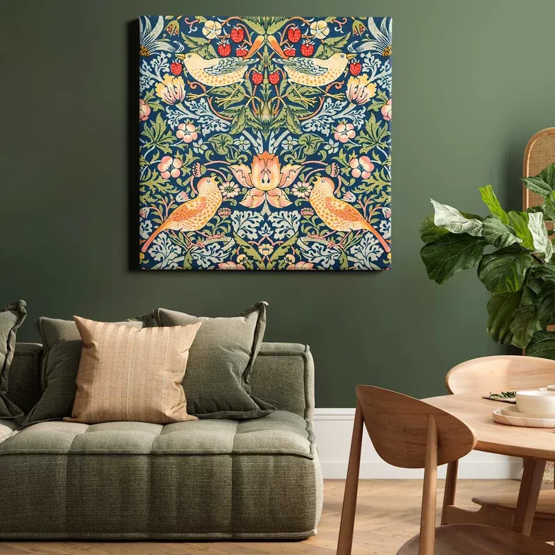 Strawberry Thief square canvas above a green sofa in a catalogue room scene